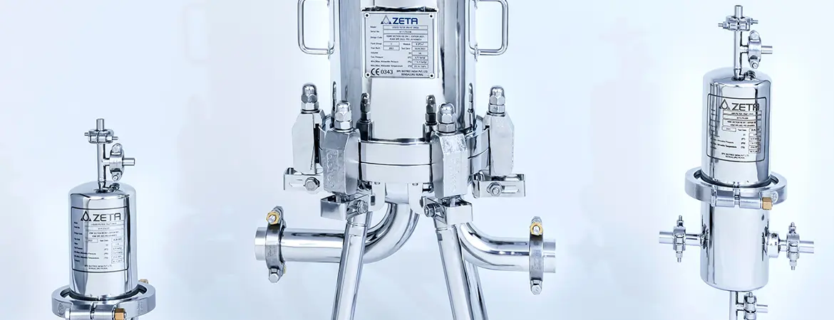 The image shows three shiny metal devices used in industrial processing. All are labeled 