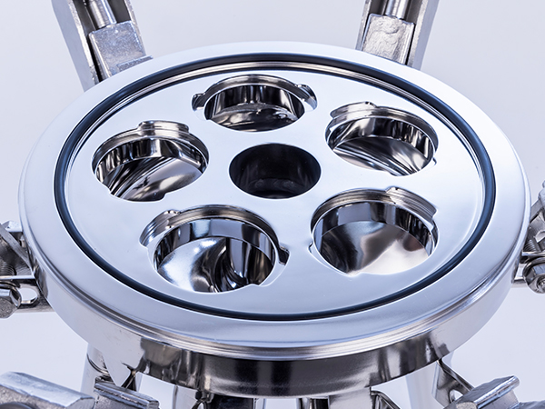 A round metal part with six evenly spaced holes is shown. It looks like a precisely machined component, possibly used in industrial or mechanical equipment for high-accuracy tasks.