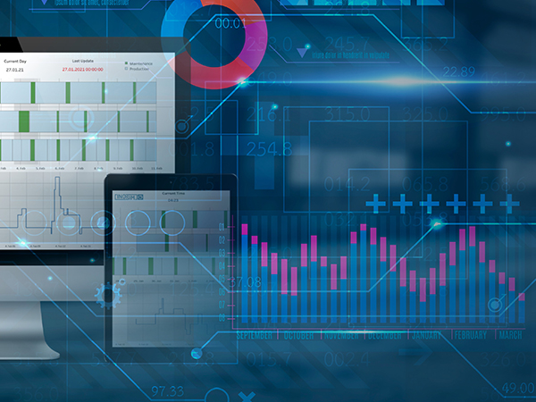 Digital dashboard showing charts and graphs on a computer monitor and tablet, including bar graphs, line charts, and circular diagrams representing data analytics.