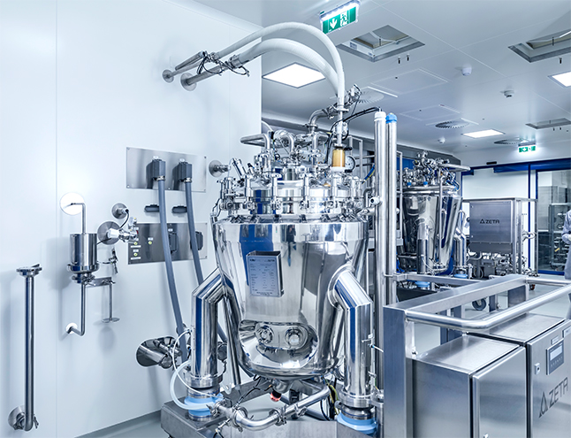 Mobile skid in production area docked with tubings to the docking station on the wall