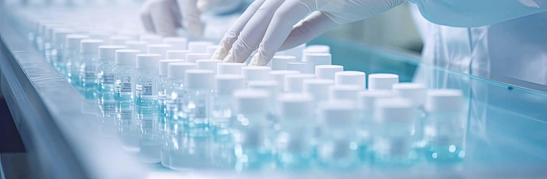 hand with sanitary gloves check Medical vials on production line